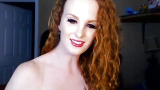 Busty redhead babe masturbating on camera