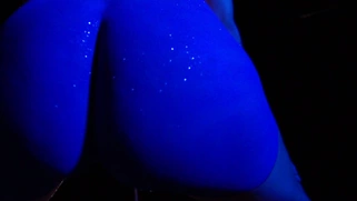 Stevie Shae dancing on stage wearing nothing but body paint