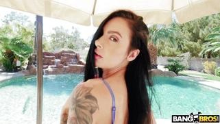 Brunette Marley Brinx in sexu lingerie posing by the pool